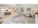 Open concept living room view into kitchen, offering seating, neutral colors, and good flow for entertaining at 24036 Spartina Dr, Venice, FL 34293