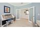 Well-designed music room with an electric organ and desk area provides versatility for work or creative hobbies at 24036 Spartina Dr, Venice, FL 34293
