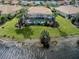 Aerial view of home with pool, screened in patio, and lake views at 246 Montelluna Dr, North Venice, FL 34275