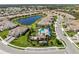 Aerial view of the community pool, hot tub, and outdoor clubhouse at 27440 Janzen Ct, Englewood, FL 34223