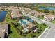Community pool, hot tub, and outdoor clubhouse from a high vantage point at 27440 Janzen Ct, Englewood, FL 34223