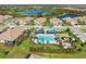 Luxury community featuring a large swimming pool, hot tub, and picnic area at 27440 Janzen Ct, Englewood, FL 34223