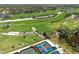 Aerial view of golf course and tennis courts at 27440 Janzen Ct, Englewood, FL 34223