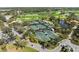 Aerial view of tennis courts and golf course at 27440 Janzen Ct, Englewood, FL 34223