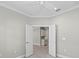 Inviting entryway with tiled floors and double doors that open to a light-filled kitchen at 27440 Janzen Ct, Englewood, FL 34223