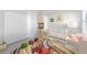 Charming Bedroom with modern decor, crib, and storage, creating a cozy space at 27440 Janzen Ct, Englewood, FL 34223