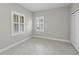 Comfortable bedroom with tile floors, bright windows and a double-door closet for ample storage space at 27440 Janzen Ct, Englewood, FL 34223