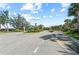 Grand community entrance with elegant landscaping and well-maintained roads at 27440 Janzen Ct, Englewood, FL 34223