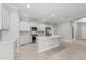 Bright, open kitchen with stainless steel appliances, an island and granite countertops at 27440 Janzen Ct, Englewood, FL 34223