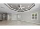 Bright living room featuring plantation shutters and neutral paint at 27440 Janzen Ct, Englewood, FL 34223