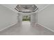 Spacious living room with recessed lighting, tile flooring, and sliding glass doors to the outside at 27440 Janzen Ct, Englewood, FL 34223