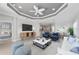 Open-concept living room featuring recessed lights, modern furnishings, and bright, airy space at 27440 Janzen Ct, Englewood, FL 34223