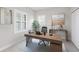 Bright home office with stylish desk, plantation shutters and neutral decor at 27440 Janzen Ct, Englewood, FL 34223