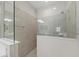 Beautiful glass shower with gray tile and modern fixtures at 27440 Janzen Ct, Englewood, FL 34223