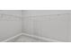 Spacious walk-in closet with installed metal racking for efficient and customizable storage solutions at 27440 Janzen Ct, Englewood, FL 34223