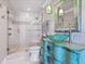 Elegant bathroom featuring a stylish vanity with a unique sink and a glass-enclosed shower at 2821 Casey Key Rd, Nokomis, FL 34275