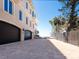Exterior elevation of a luxurious two-story home with a paver driveway and a two-car garage at 2821 Casey Key Rd, Nokomis, FL 34275