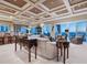Spacious living room with coffered ceilings, ocean views, and elegant furnishings at 2821 Casey Key Rd, Nokomis, FL 34275