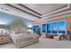 Bright main bedroom with ocean view, sitting area, and stylish decor at 2821 Casey Key Rd, Nokomis, FL 34275