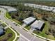 Aerial view of a home showcasing its backyard with trees and proximity to neighborhood amenities at 29260 Coral Harbour Dr, Englewood, FL 34223