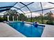 Beautiful screened-in pool with a built-in spa, offering a peaceful outdoor oasis for relaxation and enjoyment at 29260 Coral Harbour Dr, Englewood, FL 34223