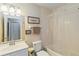 Cozy bathroom featuring a shower, toilet and modern vanity at 2983 Greendale Rd, North Port, FL 34287
