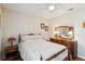 Neutral bedroom featuring wood floors, a ceiling fan and a vintage dresser at 2983 Greendale Rd, North Port, FL 34287