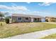 Charming single-story home with a well-manicured front yard and inviting curb appeal at 2983 Greendale Rd, North Port, FL 34287