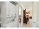 Hallway featuring washer and dryer hookups, leading into the living area at 2983 Greendale Rd, North Port, FL 34287