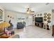 Cozy living room featuring tile flooring, a large window, and a stylish seating arrangement at 2983 Greendale Rd, North Port, FL 34287