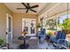Relaxing covered patio with comfortable seating and views of the landscaped backyard at 2983 Greendale Rd, North Port, FL 34287