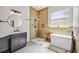 Stylish bathroom with a wood-look tiled shower, glass enclosure, free-standing tub, and modern vanity at 312 Londonderry Dr, Sarasota, FL 34240