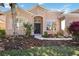 Charming home featuring a manicured lawn and neatly landscaped flowerbeds leading to a welcoming front entrance at 312 Londonderry Dr, Sarasota, FL 34240