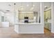 Modern kitchen featuring pendant lighting, island with quartz countertops, and stainless appliances at 312 Londonderry Dr, Sarasota, FL 34240