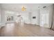 Spacious living room with wood floors, recessed lighting, and open floor plan at 312 Londonderry Dr, Sarasota, FL 34240