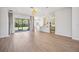 Open-concept living space connecting the living room, kitchen, and dining area, creating a seamless flow for modern living at 312 Londonderry Dr, Sarasota, FL 34240