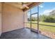 Relax on this screened patio and enjoy the view of the green lawn and sunny skies at 312 Londonderry Dr, Sarasota, FL 34240