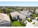 Aerial view of a charming home with a well-manicured lawn, complemented by a lake view at 339 Marsh Creek Rd, Venice, FL 34292