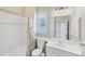 Clean bathroom featuring a shower-tub combo with a white vanity and tiled floor at 339 Marsh Creek Rd, Venice, FL 34292