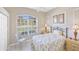Comfortable bedroom with a large window that provides natural light and a tranquil view at 339 Marsh Creek Rd, Venice, FL 34292