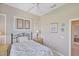 Comfortable bedroom with a large window that provides natural light and a tranquil view at 339 Marsh Creek Rd, Venice, FL 34292