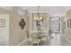 Elegant dining area featuring a chandelier and stylish decor at 339 Marsh Creek Rd, Venice, FL 34292