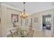 Charming dining area adjacent to an office with natural light at 339 Marsh Creek Rd, Venice, FL 34292