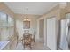 Inviting dining nook featuring modern lighting and ample natural light at 339 Marsh Creek Rd, Venice, FL 34292