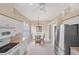 Bright dining area off kitchen with white cabinets and stainless steel appliances at 339 Marsh Creek Rd, Venice, FL 34292