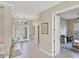 Bright foyer with transom window and an adjacent home office at 339 Marsh Creek Rd, Venice, FL 34292