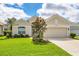 Well-maintained single-story home with beautiful landscaping and an attached two car garage at 339 Marsh Creek Rd, Venice, FL 34292