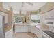 Clean kitchen with sleek appliances and seamless views to the bright lanai at 339 Marsh Creek Rd, Venice, FL 34292