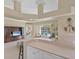 Bright living room with seamless access to the screened pool and lanai at 339 Marsh Creek Rd, Venice, FL 34292