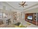 Spacious living room with a stylish ceiling fan and an entertainment center at 339 Marsh Creek Rd, Venice, FL 34292